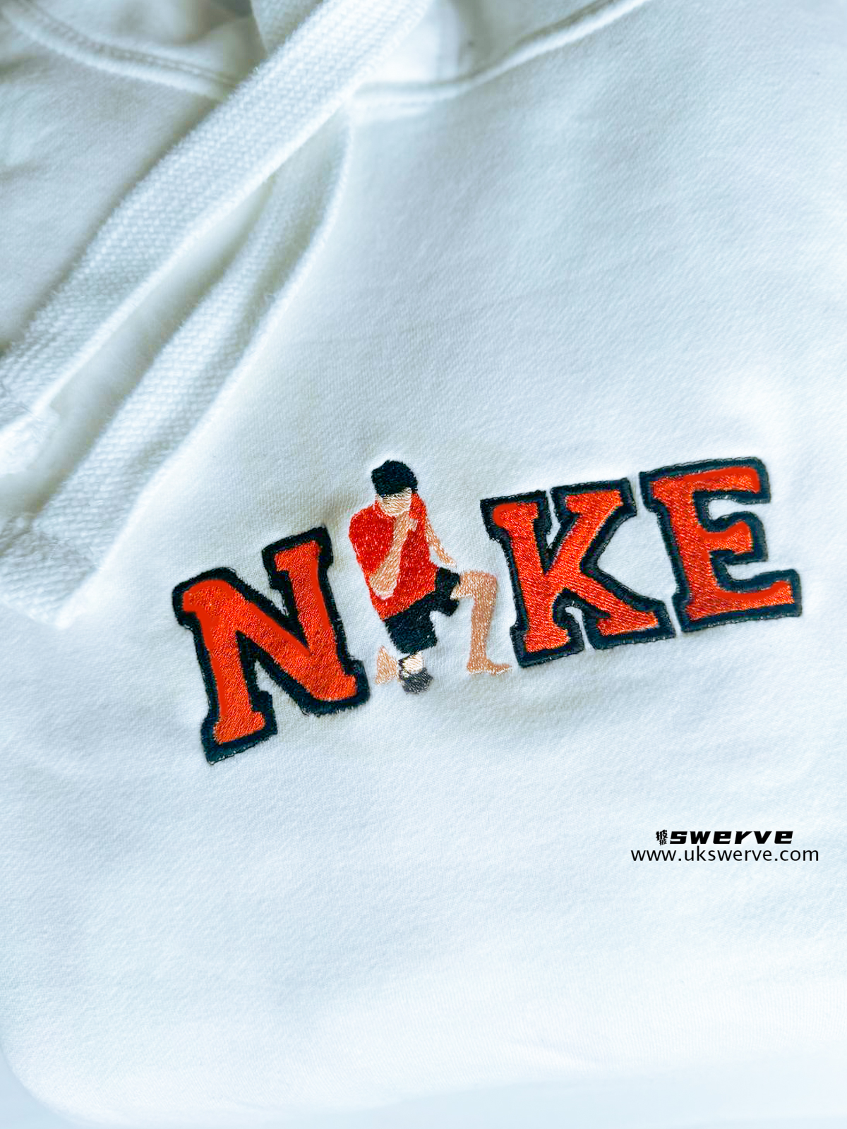"NYC Graphic Hoodie featuring a full-color graphic of the NYC skyline, showcasing streetwear style with ribbed cuffs and a double fabric hood for extra warmth."