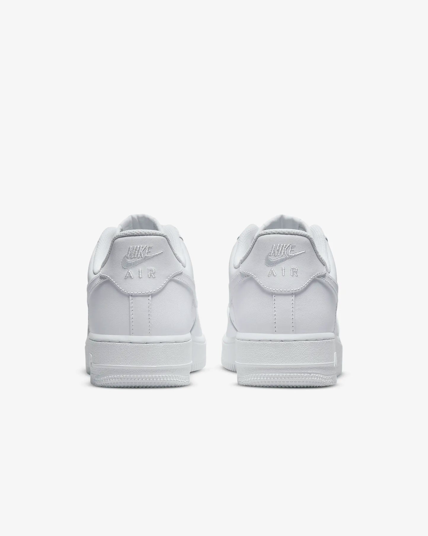 "Nike Air Force 1 '07 sneakers with durably stitched overlays and sleek design, featuring a clean, bold look and comfortable cushioned sole."