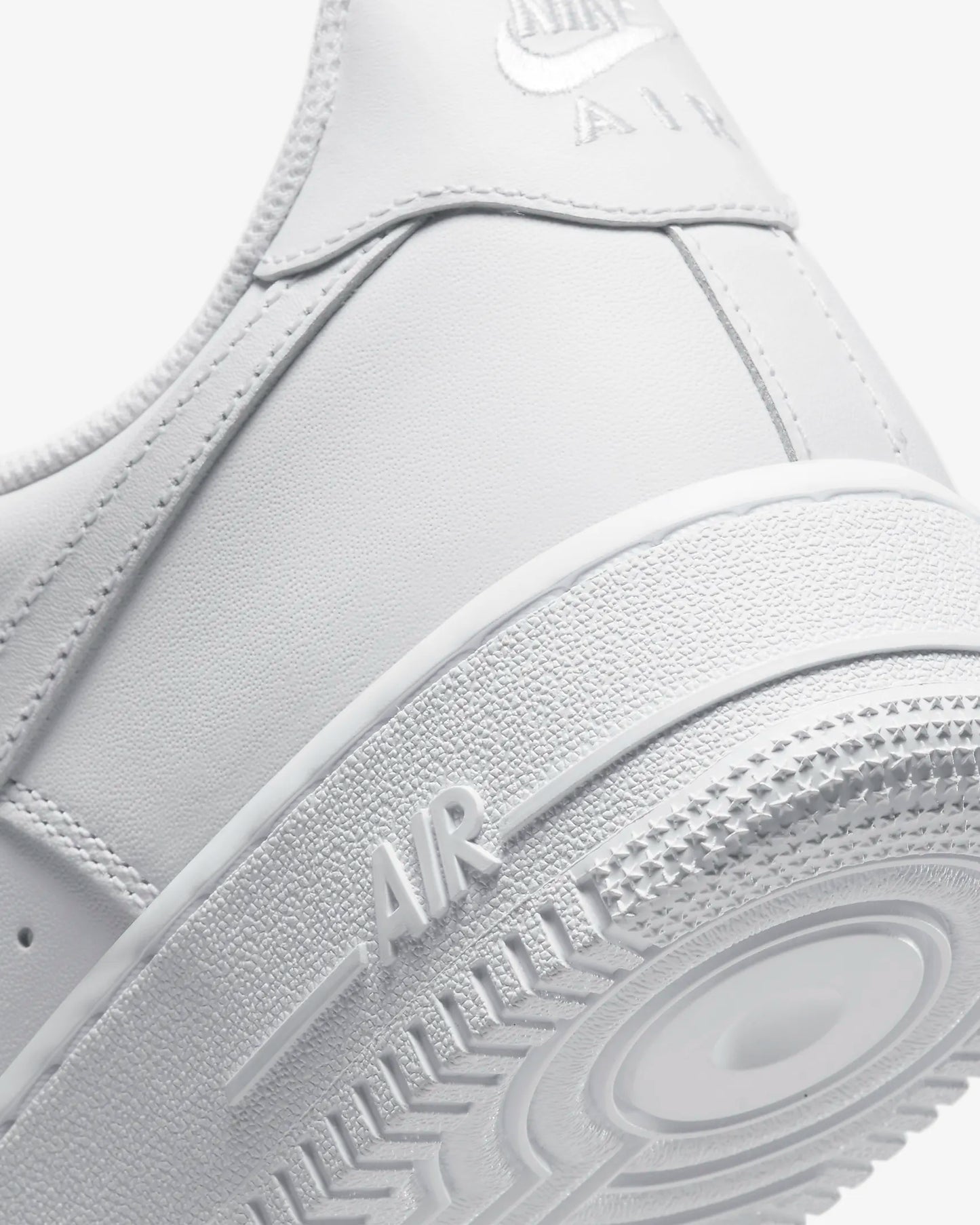 "Nike Air Force 1 '07 sneakers with durably stitched overlays and sleek design, featuring a clean, bold look and comfortable cushioned sole."